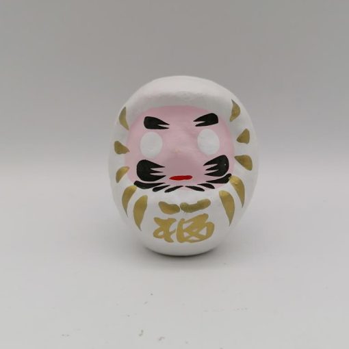 Bambola Daruma bianca tradizionale giapponese, vista frontale con dettagli del volto stilizzato