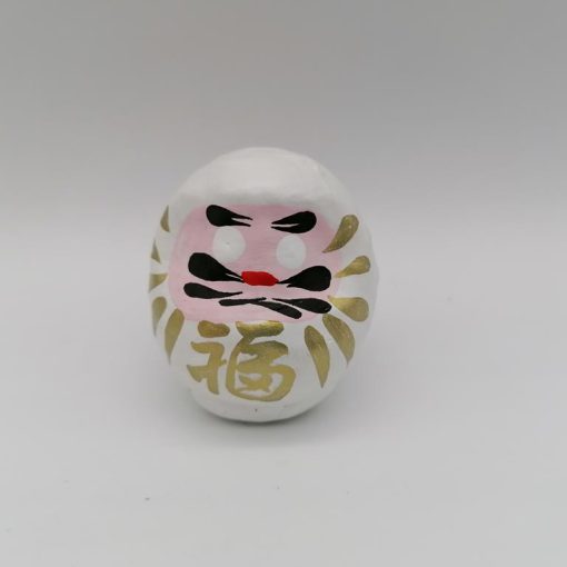 Bambola Daruma bianca tradizionale giapponese, vista frontale con dettagli del volto stilizzato